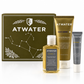ATWATER skincare gift set featuring a gold box with constellation graphics, a gold Facial Moisturizer tube, a yellow Facial Cleansing Gel bottle, and a gray Eye Moisturizer tube on a white reflective surface.