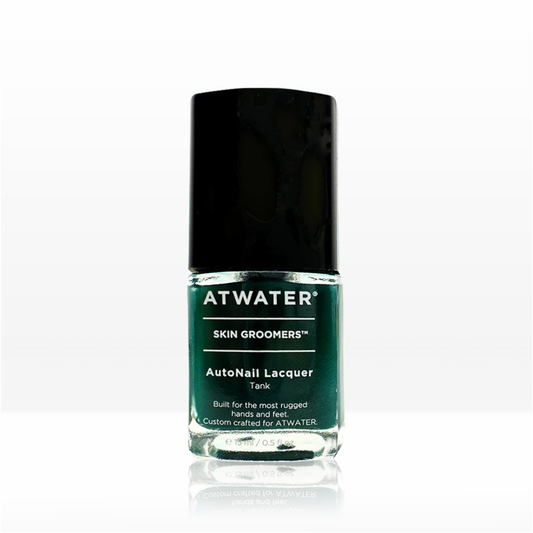 Green nail polish bottle with black cap on a white background