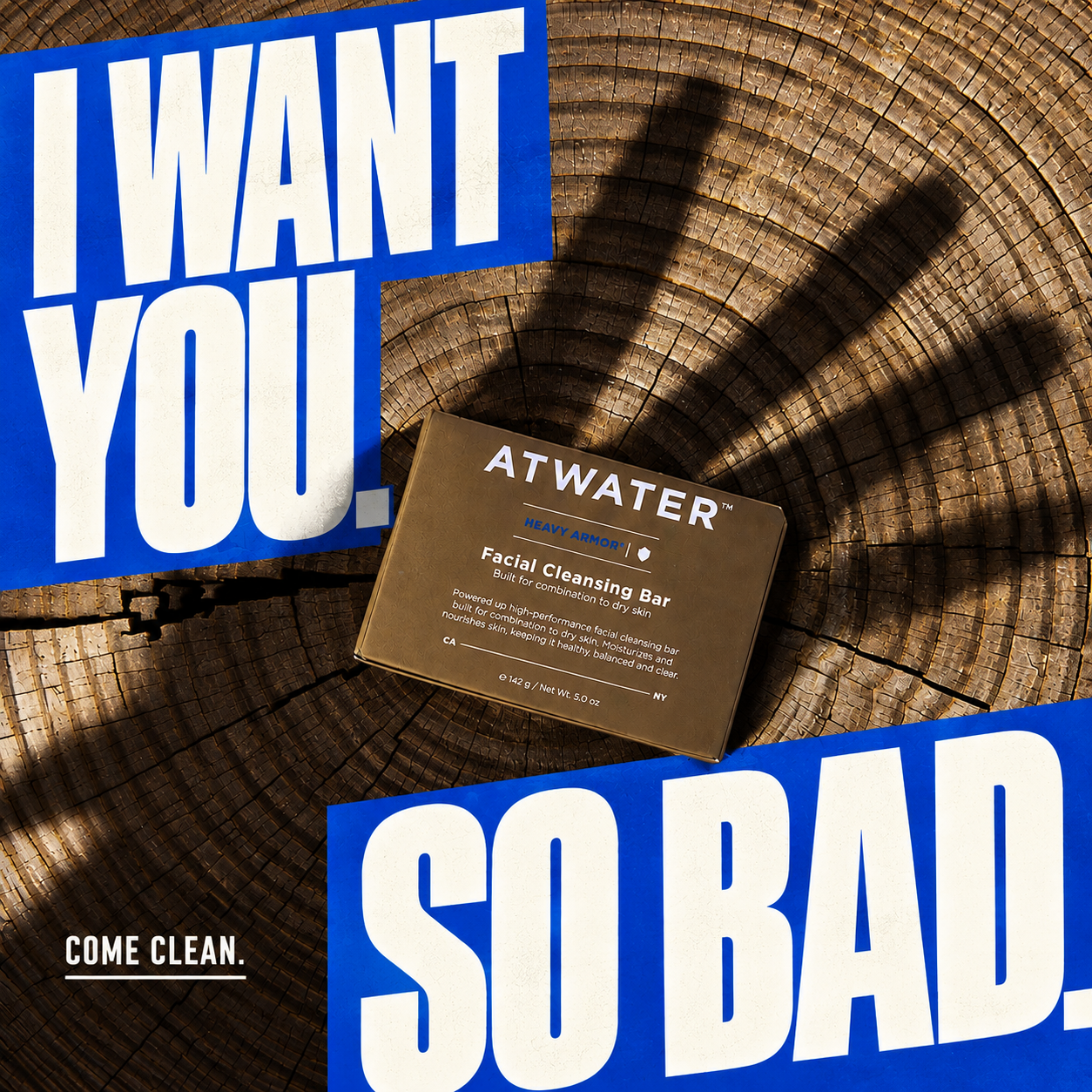 A square product graphic featuring a brown rectangular cleansing bar package labeled ATWATER Facial Cleansing Bar, placed on a wood grain surface with dramatic shadows. Large blue text blocks read 'I WANT YOU.